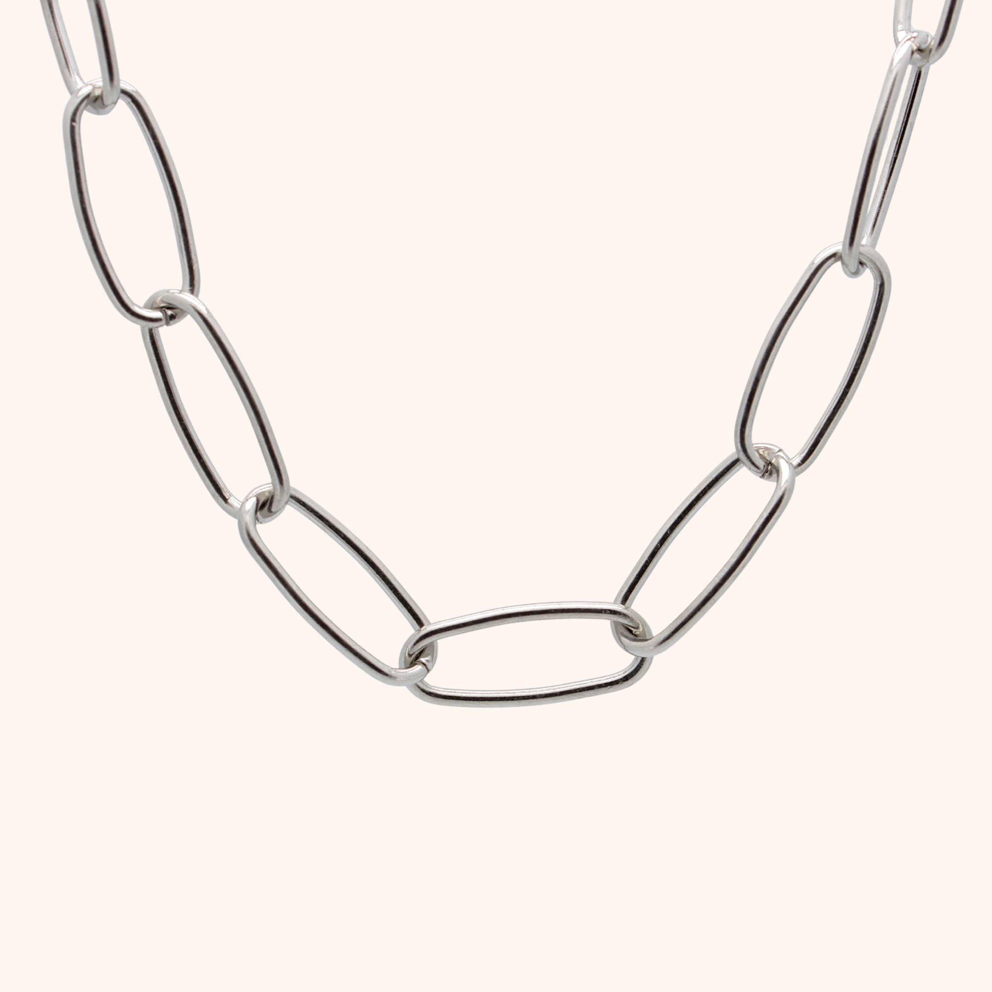 Silver chain necklace on a white background